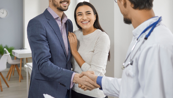 A couple talking to an IVF doctor